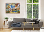 Living room with a and colorful landscape art print from an original painting by Jess King Artist on the wall.