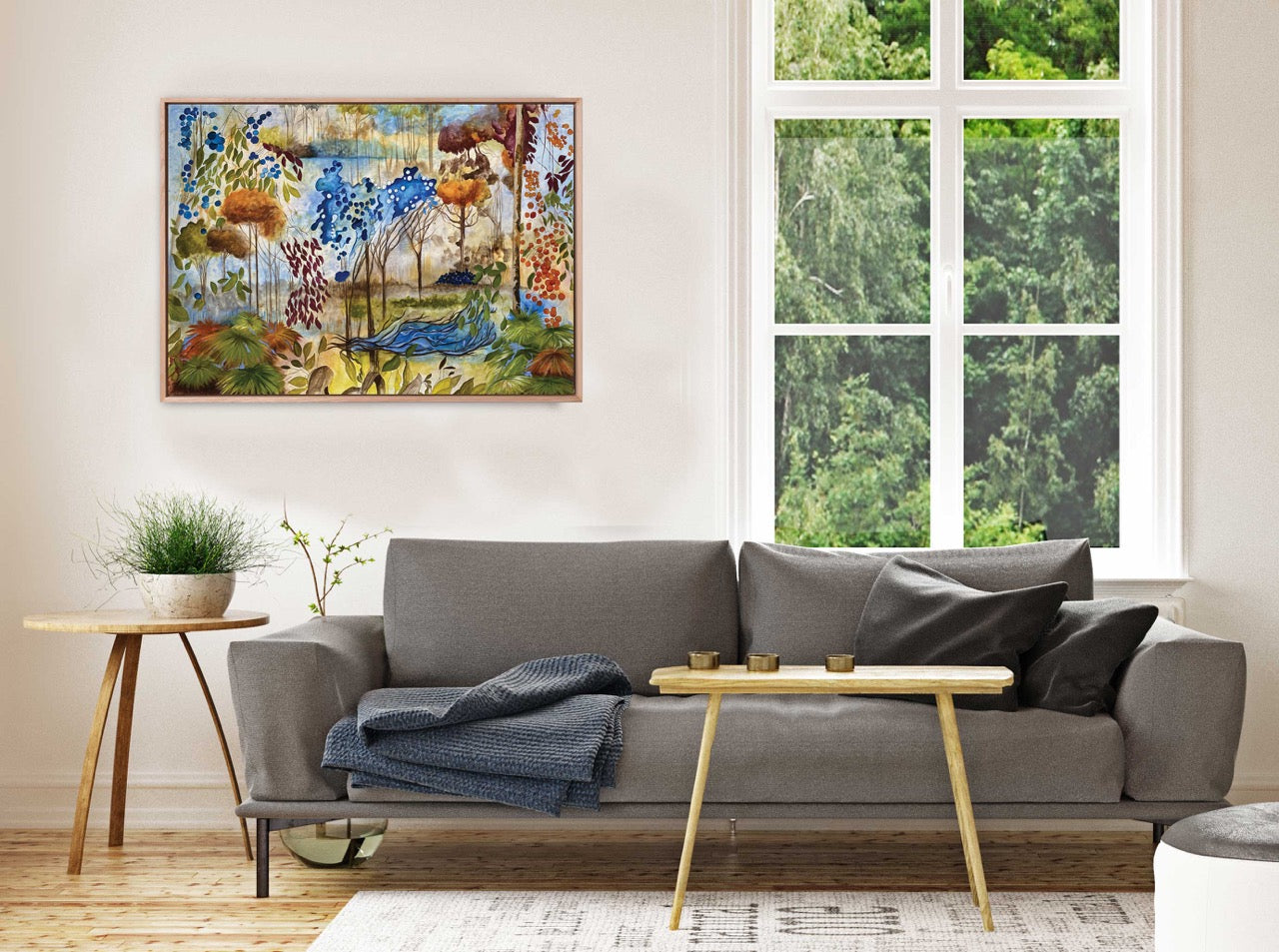Living room with a and colorful landscape art print from an original painting by Jess King Artist on the wall.
