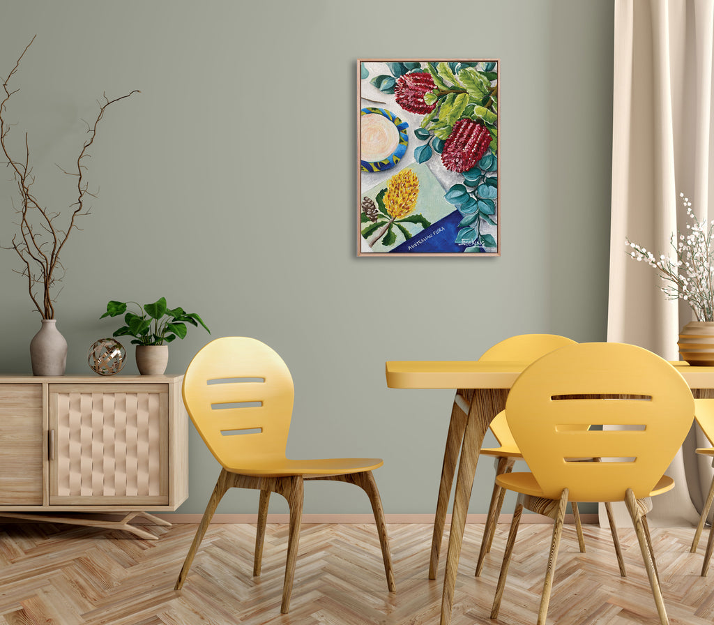 Dining room with yellow chairs, wooden table, and a colorful abstract painting on the wall.